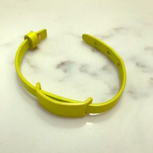 Kate Spade Leather cuff in neon yellow.